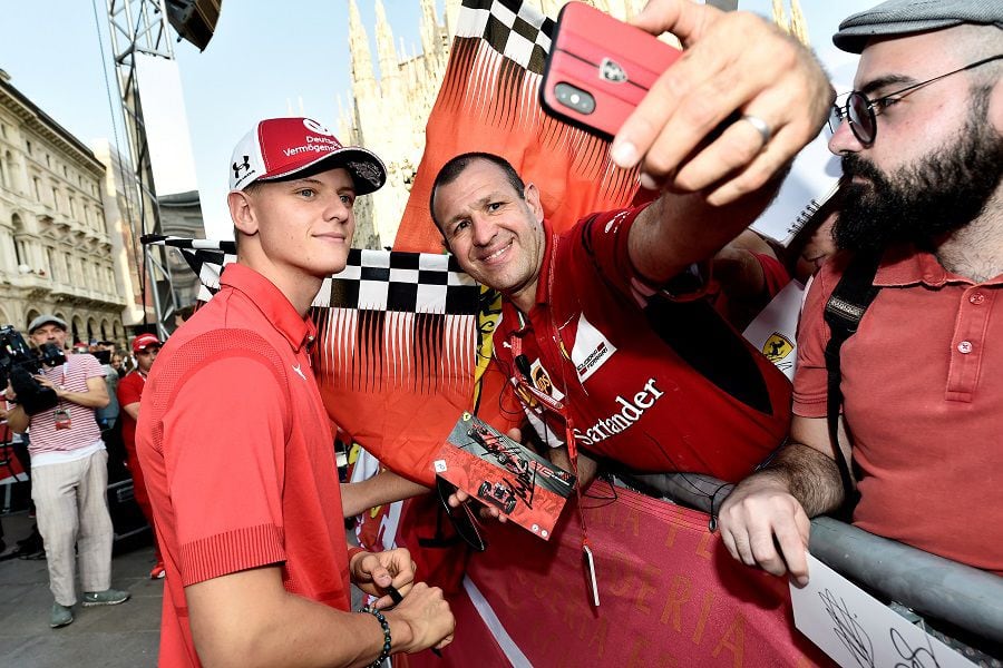 FILE PHOTO: Italian premium sports car maker Ferrari celebrates 90 years of its racing team at Milan's Duomo square