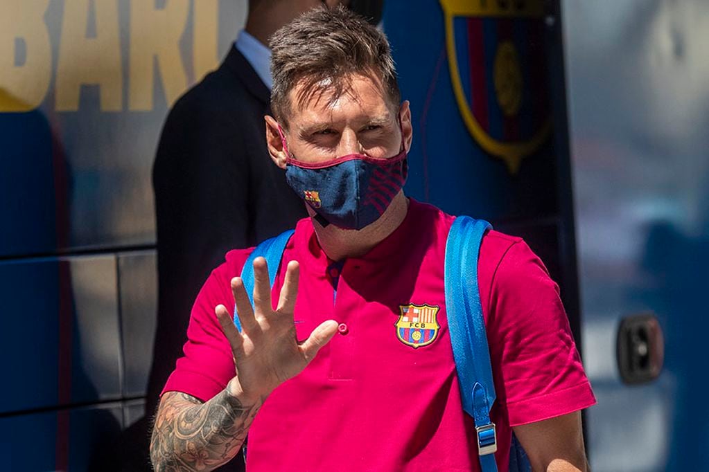 FILE - In this Aug. 13, 2020 file photo, Barcelona's Lionel Messi waves as he arrives at the team hotel in Lisbon, Portugal. Lionel Messi has told Barcelona he wants to leave the club after nearly two decades with the Spanish giants. The club has confirmed that the Argentina great has sent a note expressing his desire to leave. The announcement comes 11 days after Barcelona's humiliating 8-2 loss to Bayern Munich in the Champions League quarterfinals, one of the worst in the player's career and in the club's history.(AP Photo/Manu Fernandez, File)