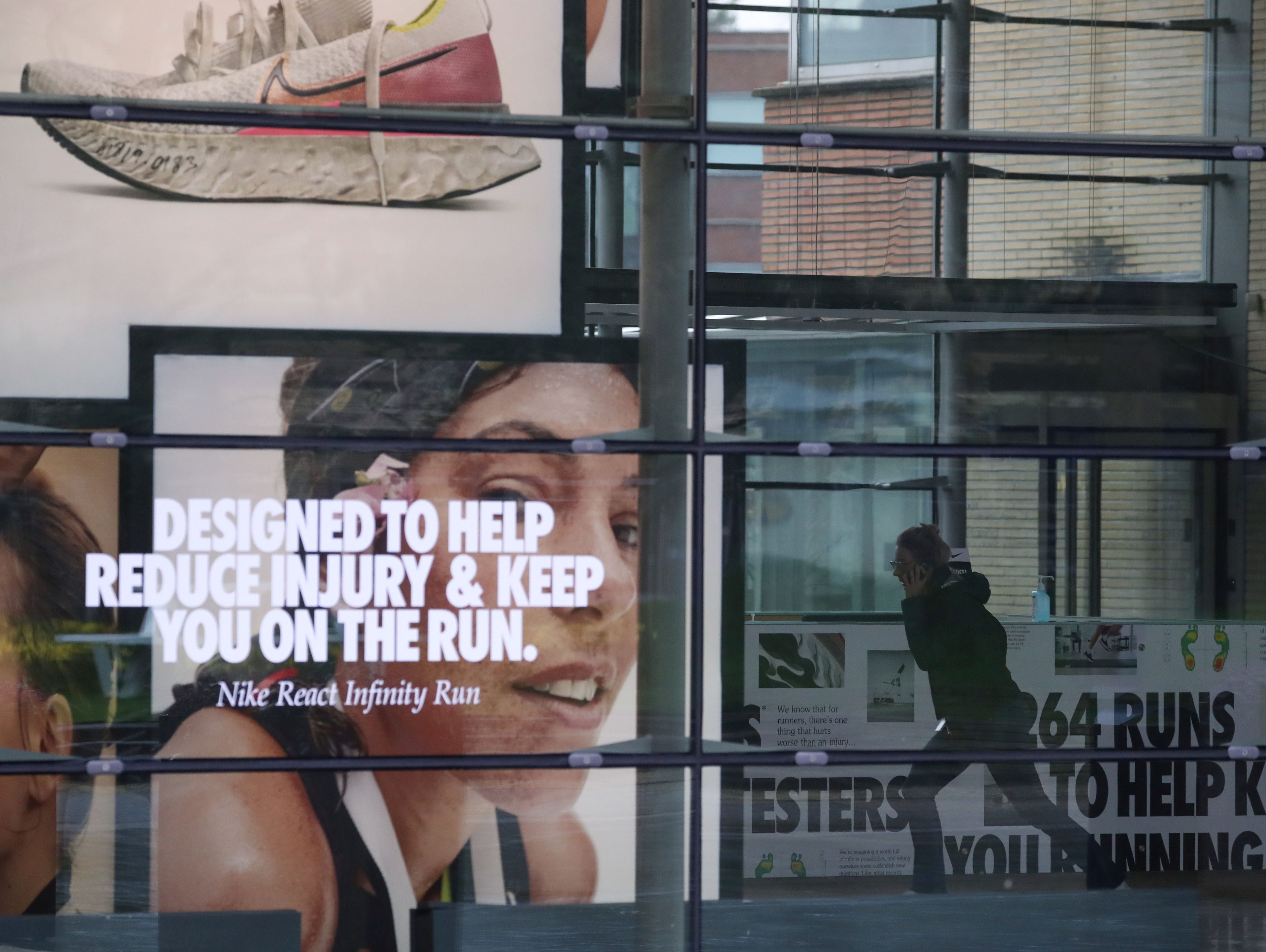 A woman runs inside the Nike European headquarters in Hilversum