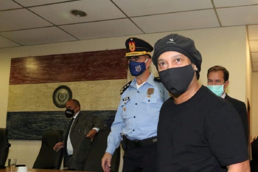 Ronaldinho is seen arriving at the hearing at the Supreme Court of Justice where he could be released from the home prison he has been holding for 4 months in a hotel in Asuncion