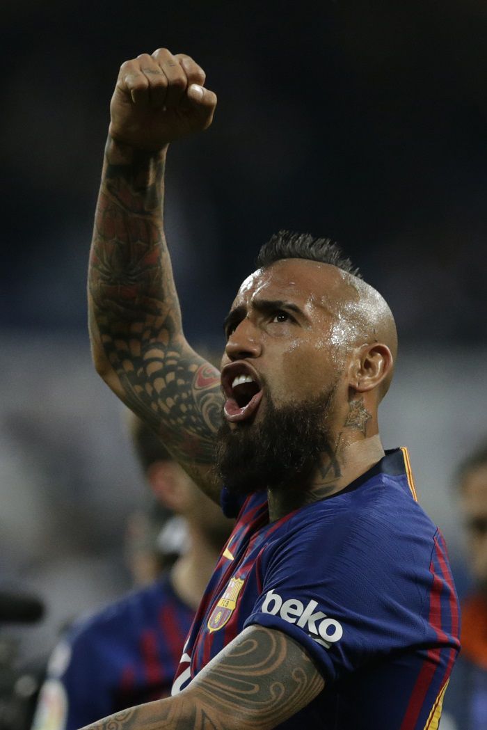 Barcelona player Arturo Vidal celebrates after winning the Spanish La