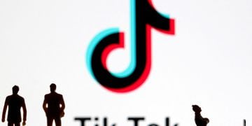 FILE PHOTO: A 3-D printed figures are seen in front of displayed Tik Tok logo in this picture illustration