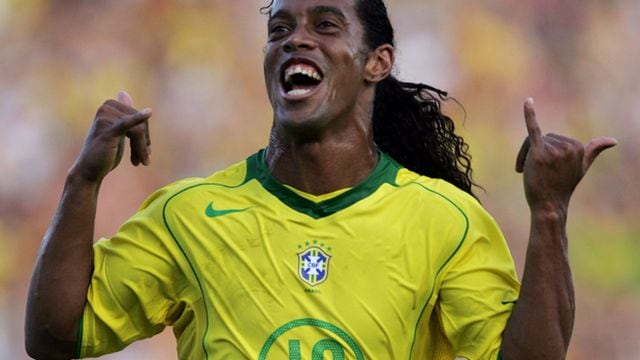 Brazil''s forward Ronaldinho celebrates after scoring on a penalty ki