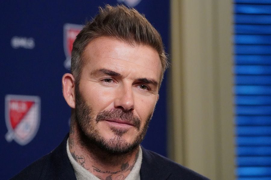 FILE PHOTO: Former soccer player and MLS team owner David Beckham speaks during an interview in the Manhattan borough of New York City