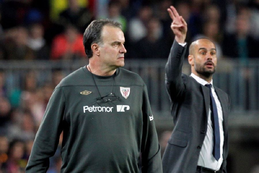 FILE PHOTO: Barcelona's coach Pep Guardiola and Athletic Bilbao's coach Marcelo Bielsa react during their Spanish First division soccer league match at Camp Nou stadium in Barcelona