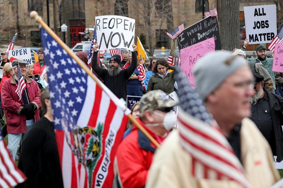 Protesters against the state's extended stay-at-home order demonstrate in Madison