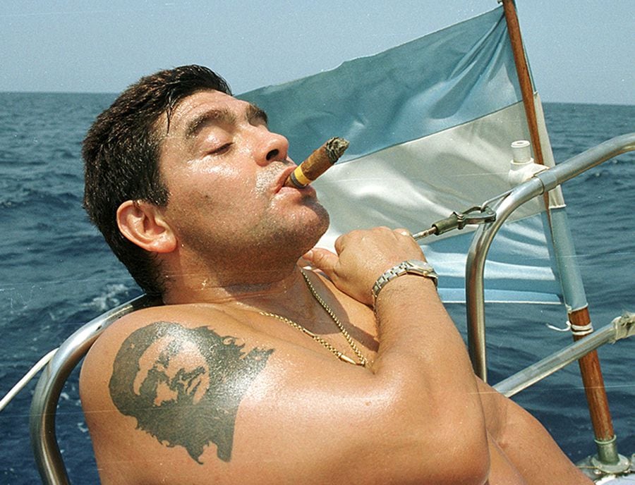 FILE PHOTO: Argentine soccer star Diego Maradona smokes a Cohiba as he rides a sailboat