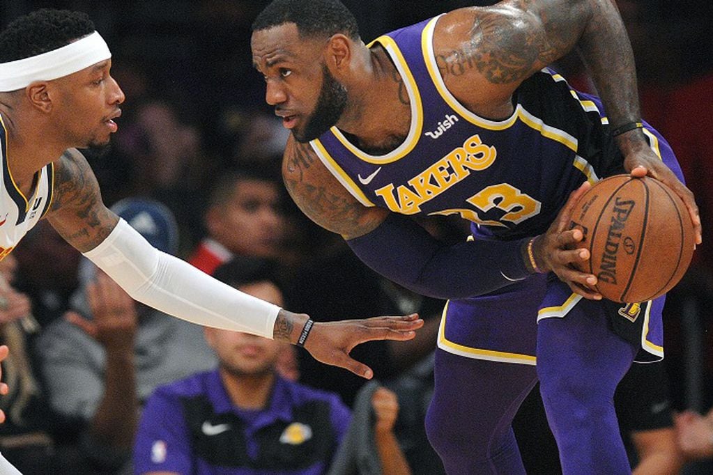 March 6, 2019; Los Angeles, CA, USA; Los Angeles Lakers forward LeBron James (23) moves the ball against Denver Nuggets forward Torrey Craig (3) during the first half at Staples Center. Mandatory Credit: Gary A. Vasquez-USA TODAY Sports BASKETBALL-NBA-LAL-DEN/